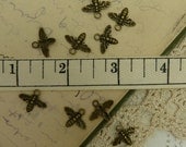 10 antique brass bee charms style size 15 mm wide by 12 mm long hole is 2 mm