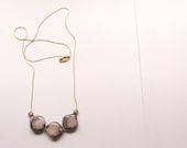 Geometric necklace.  Grey resin squares with brown aqua effect. Golden chain. Minimal jewelry
