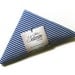 Reusable Shopping Bag, folded into a triangle, blue and white striped cotton, edged in white ribbon.