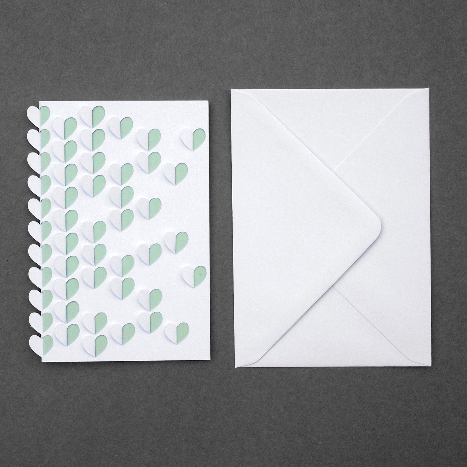 3D cut and folded scattered hearts greeting card, white with mint insert