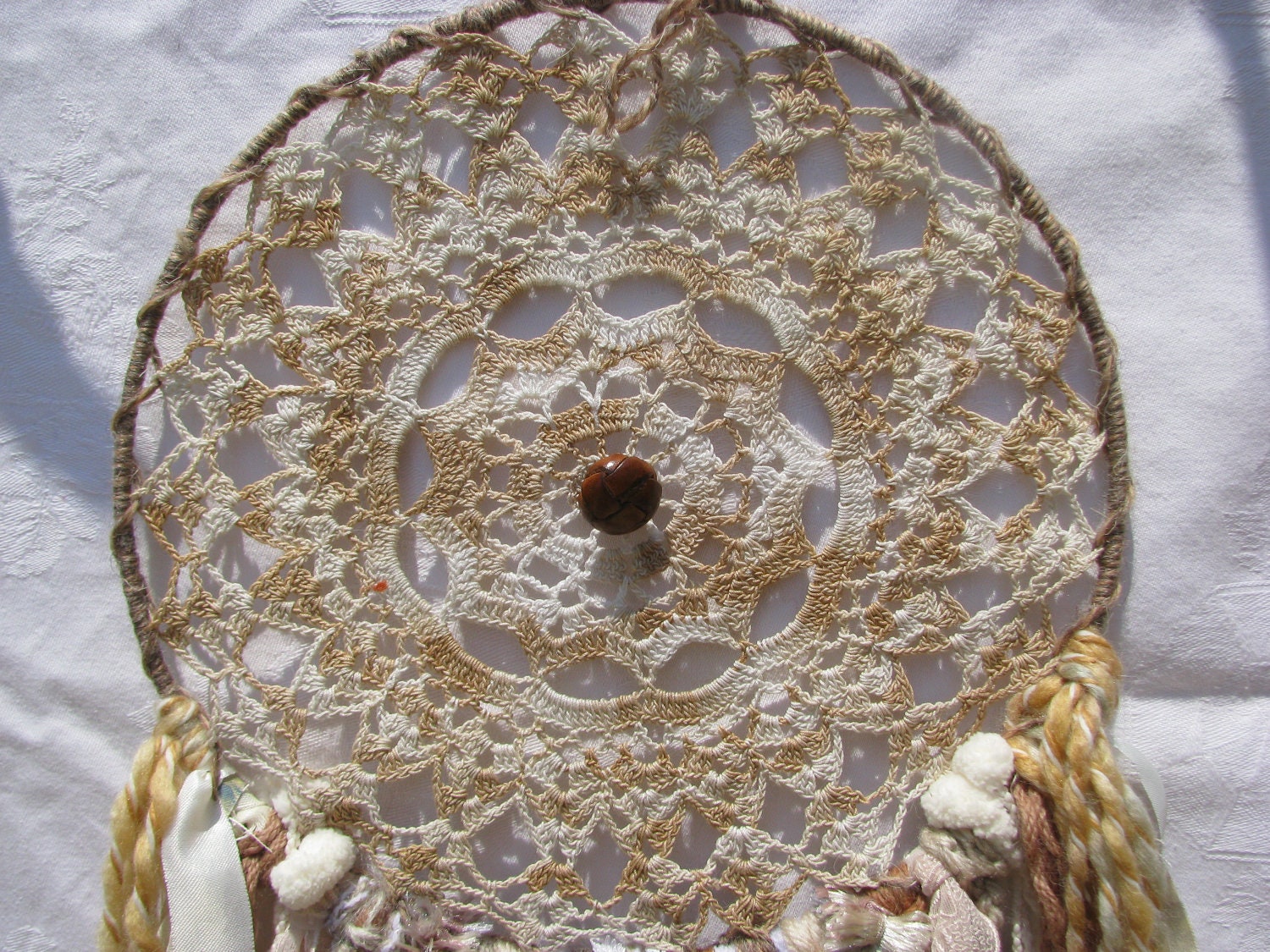 Dreamcatcher Wall Hanging - Vintage leather and lace - vintage leather button in web with yarn hanging down, beads and crystal drop