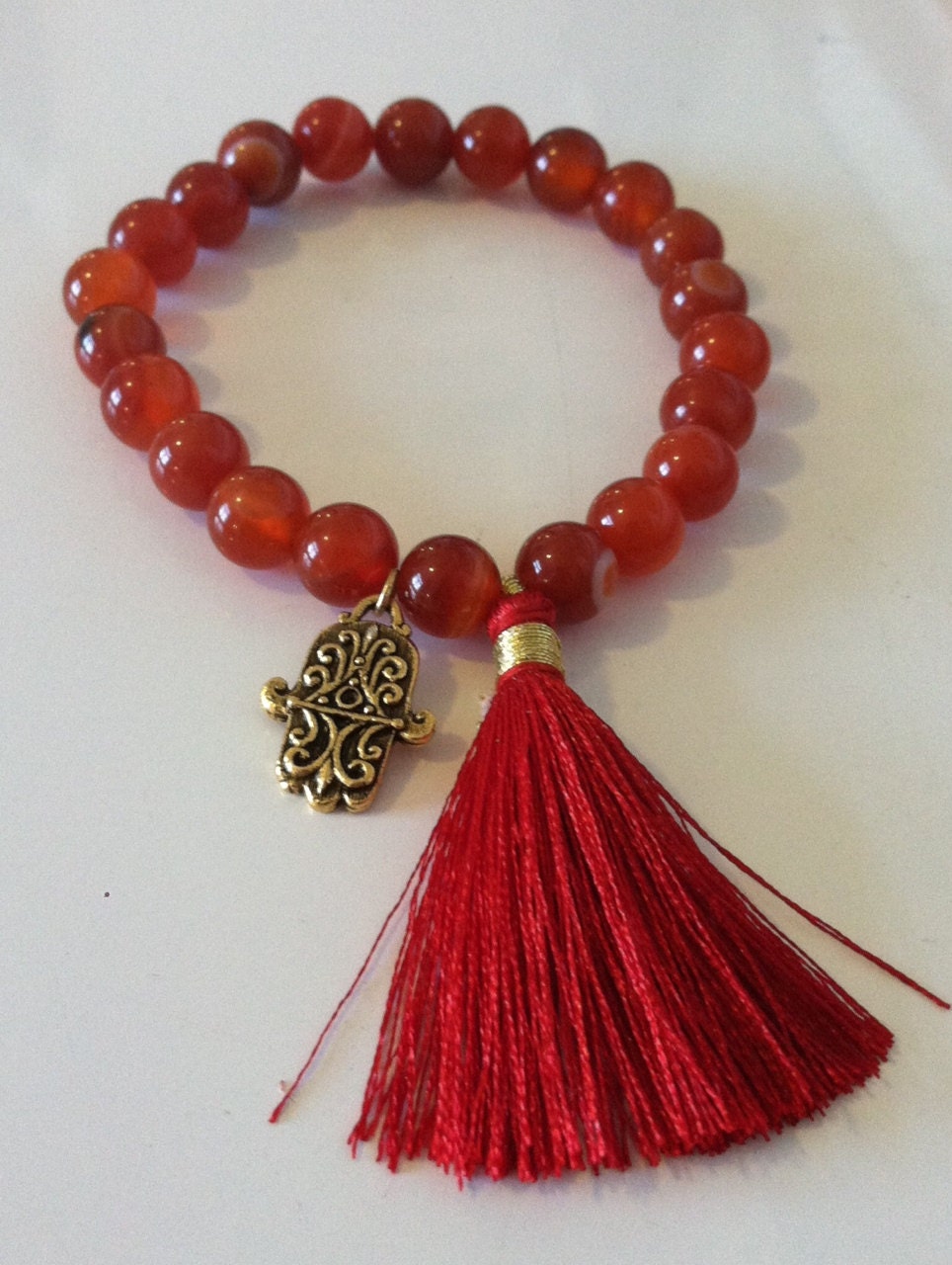 Crimson and Brass Hamsa Tassel Bracelet