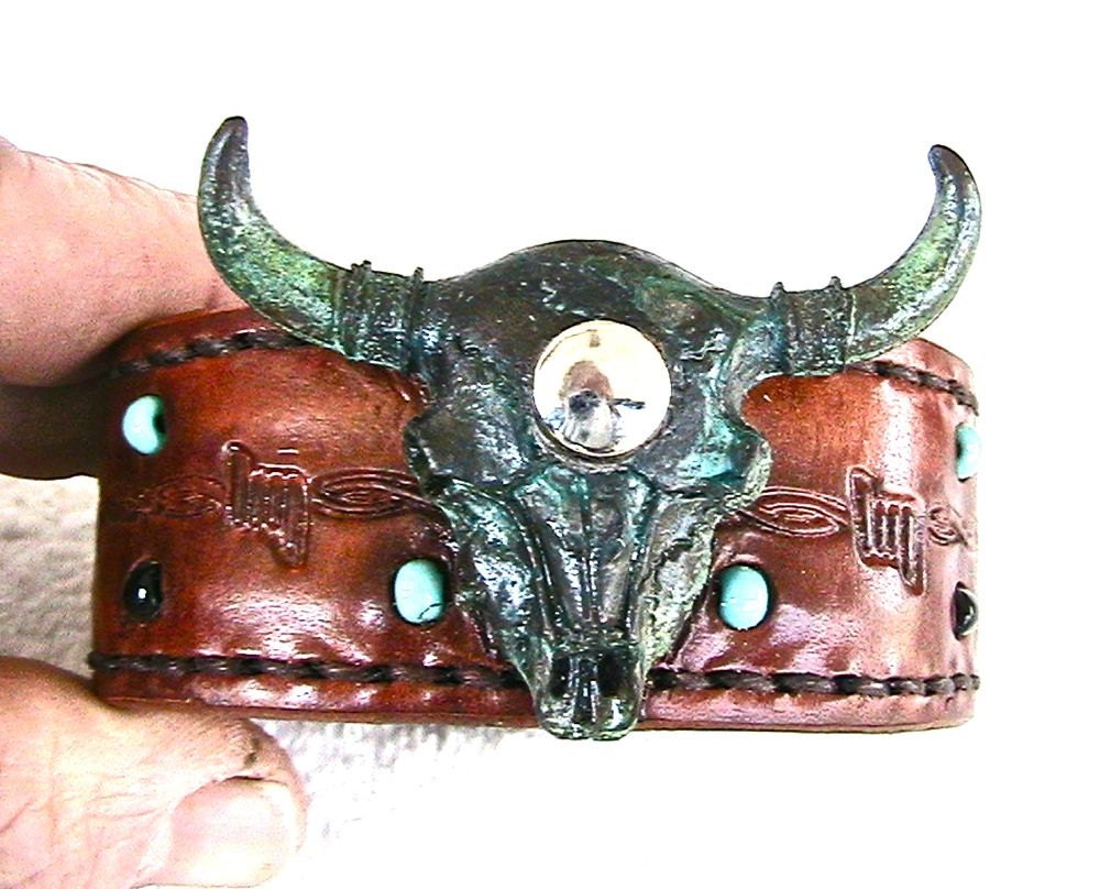 Leather wristband with glass beads and bison skulll.