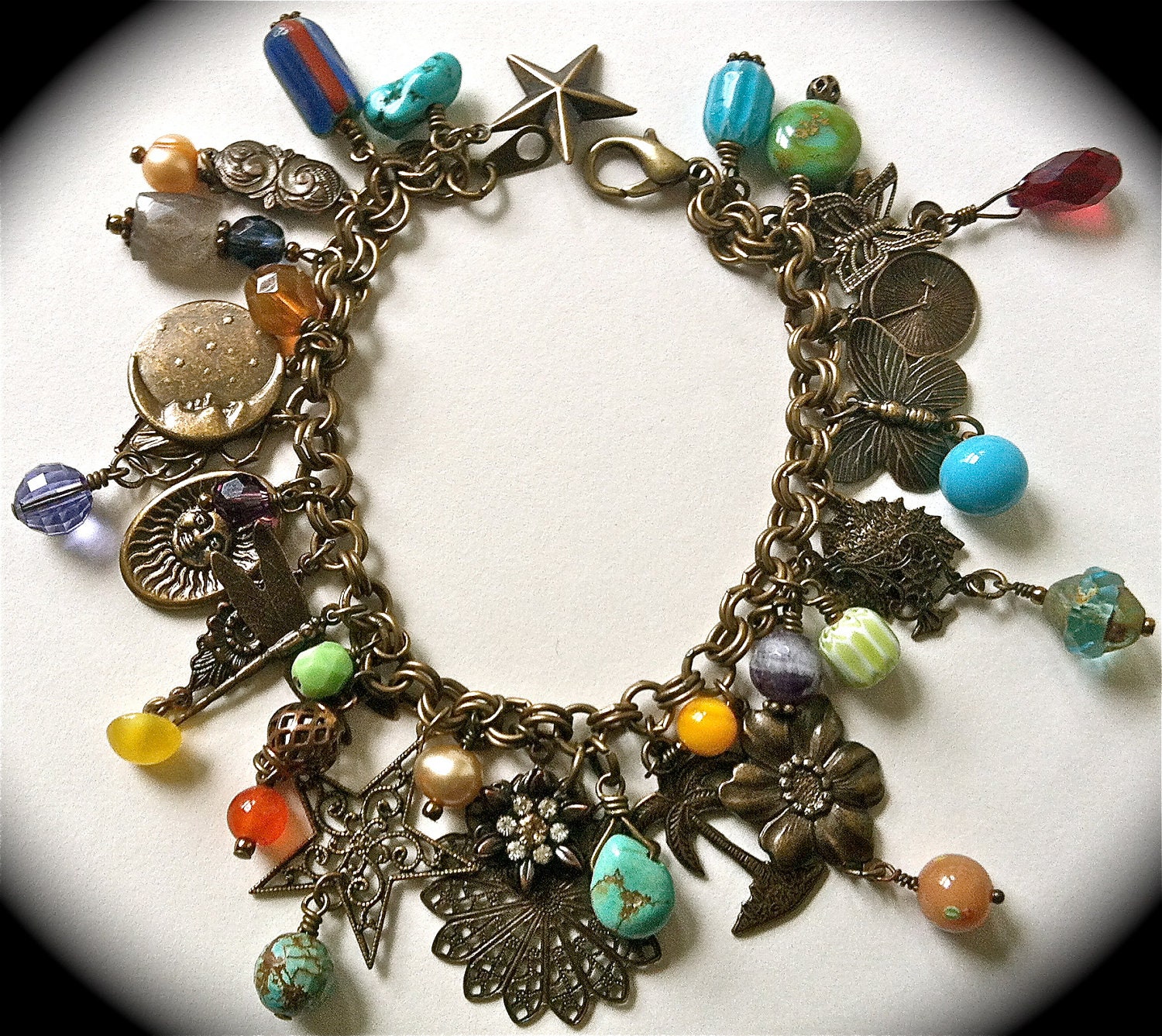 Antiqued brass charm bracelet/necklace with nature theme & vintage beads, crystals, turquoise, trade beads charms, filigree....