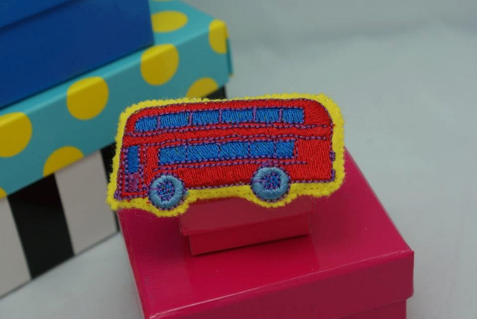 Embroidered, felt, stuffed pin with London bus.  Hand stitched.