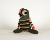 Snuggly munchkins, handmade wool monsters in grey.