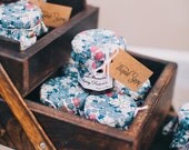 Wedding favours mini jars of strawberry preserve with pretty floral material quantity of 50