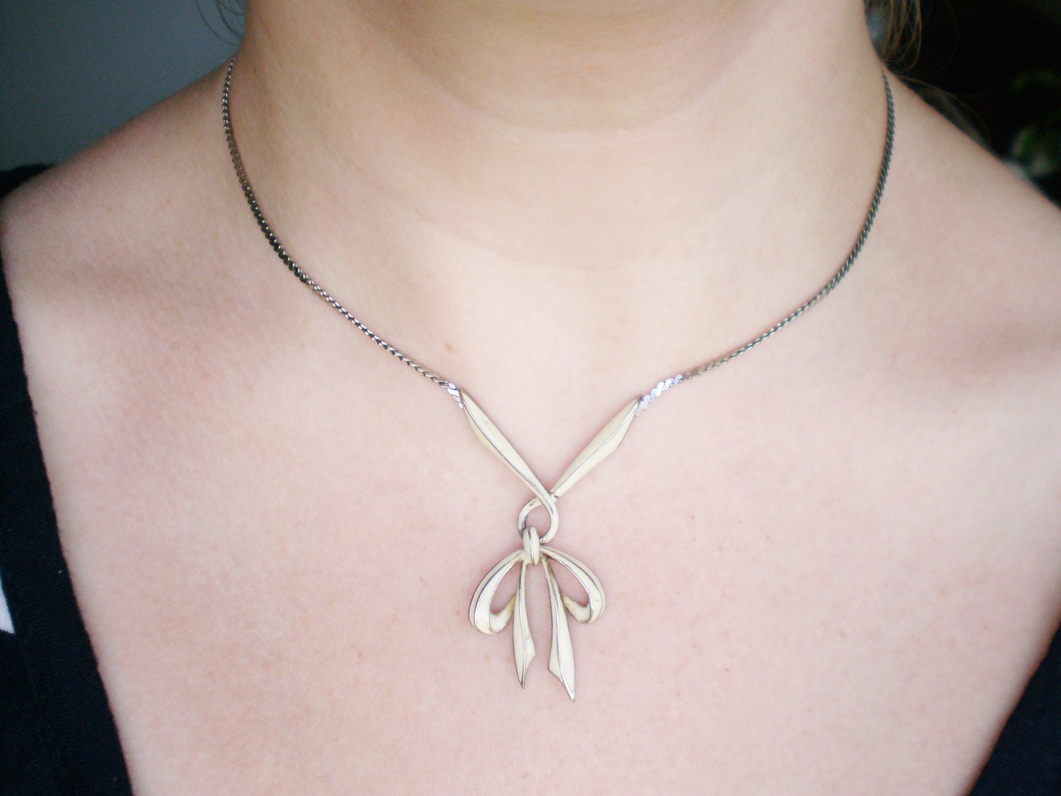 Vintage D'Orlan Necklace - 1970s Ribbon Bow Silver Tone White Enamel Dangle Style