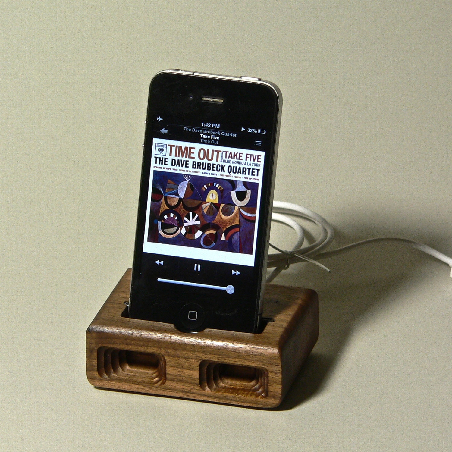 Acoustic dock  for iPhone 4 in Walnut - Amplifies sound through unique acoustical pockets .