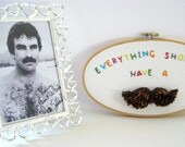 Mustache Wall Art - Funny artwork hand stitched onto an embroidery hoop.  Great gag gift.