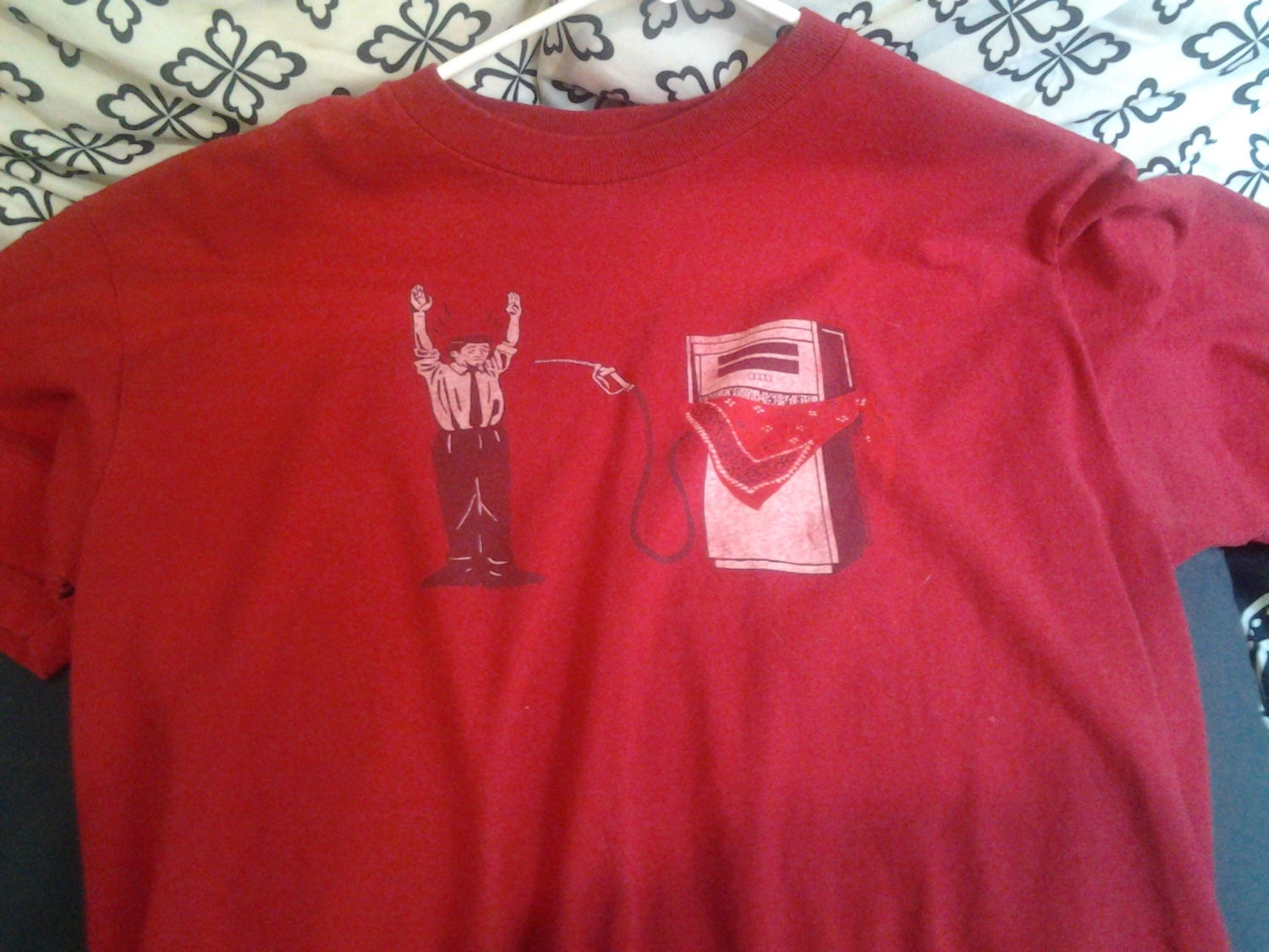 Its a stick up...Guy being held up by a gas pump tshirt.  Red funny political shirt.