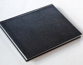The Gnotebook, a unique iPad case handmade from an engineering notebook, with internal magnets (black leather cover / black interior)