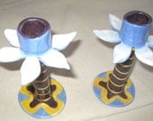 A set of 2 flower shaped one of a kind  hand crafted ceramic candle holders