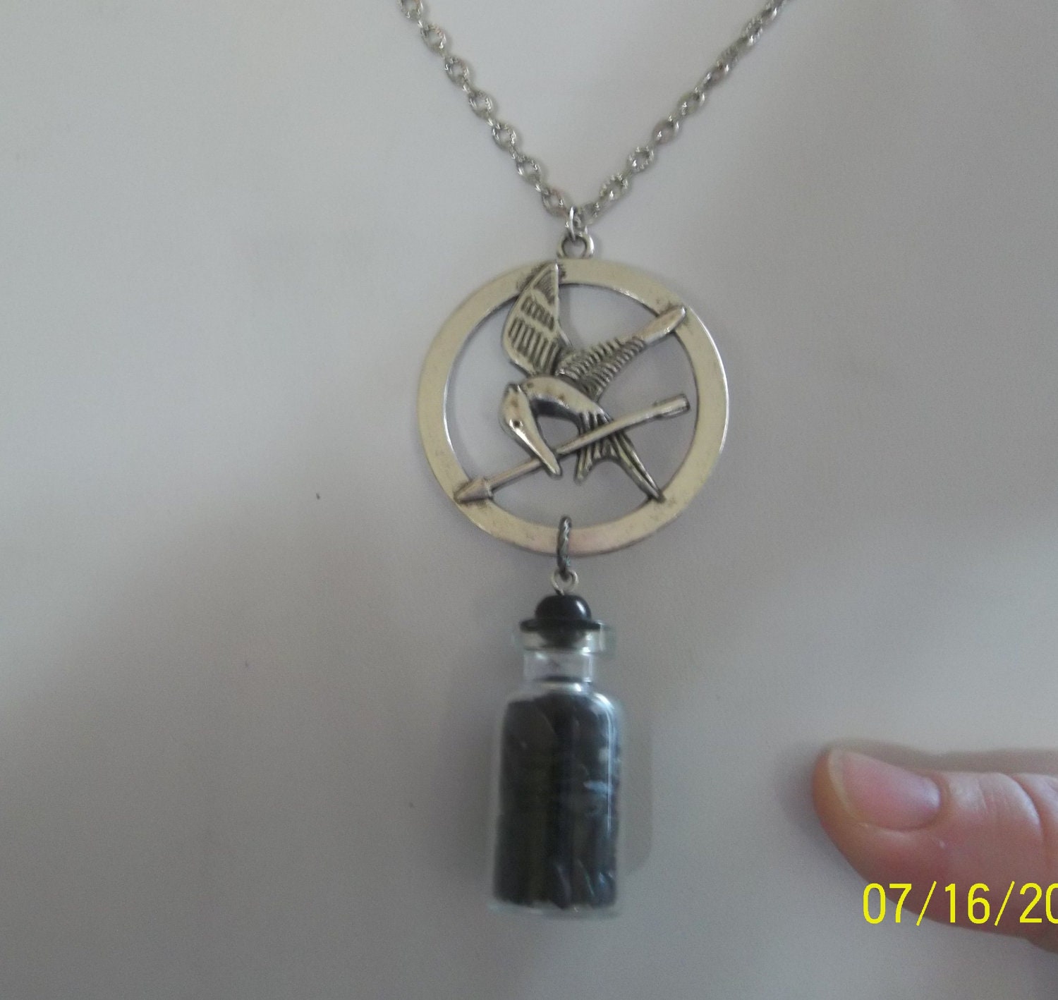 Hunger Games Pendant Necklace District 12 Coal in Vial silver necklace  Katniss Bow and Arrow Mockingjay Catching Fire Necklace