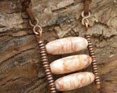 tri triple kinetic necklace kinetic pendant moving beads orange pink beaded puzzle worry stone