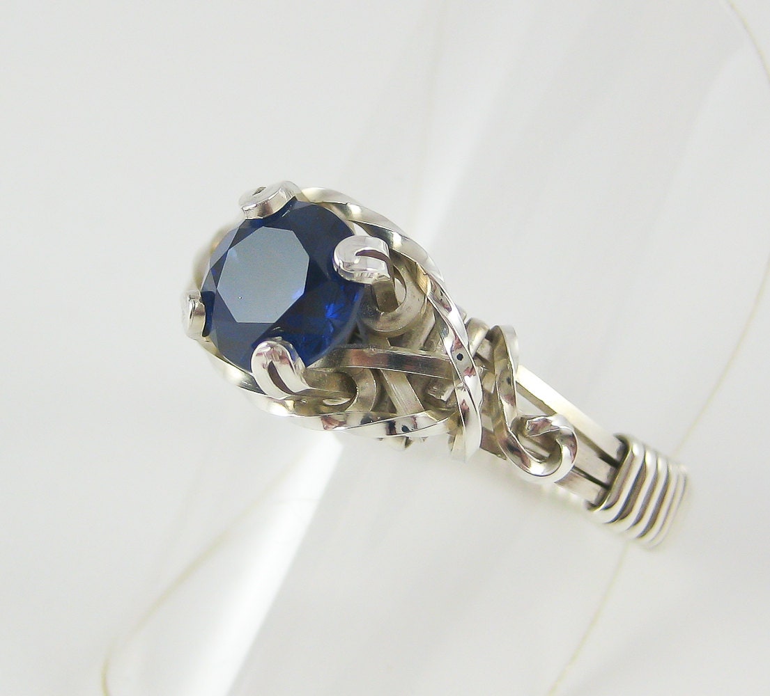 Blue sapphire solitaire wire wrapped ring in silver