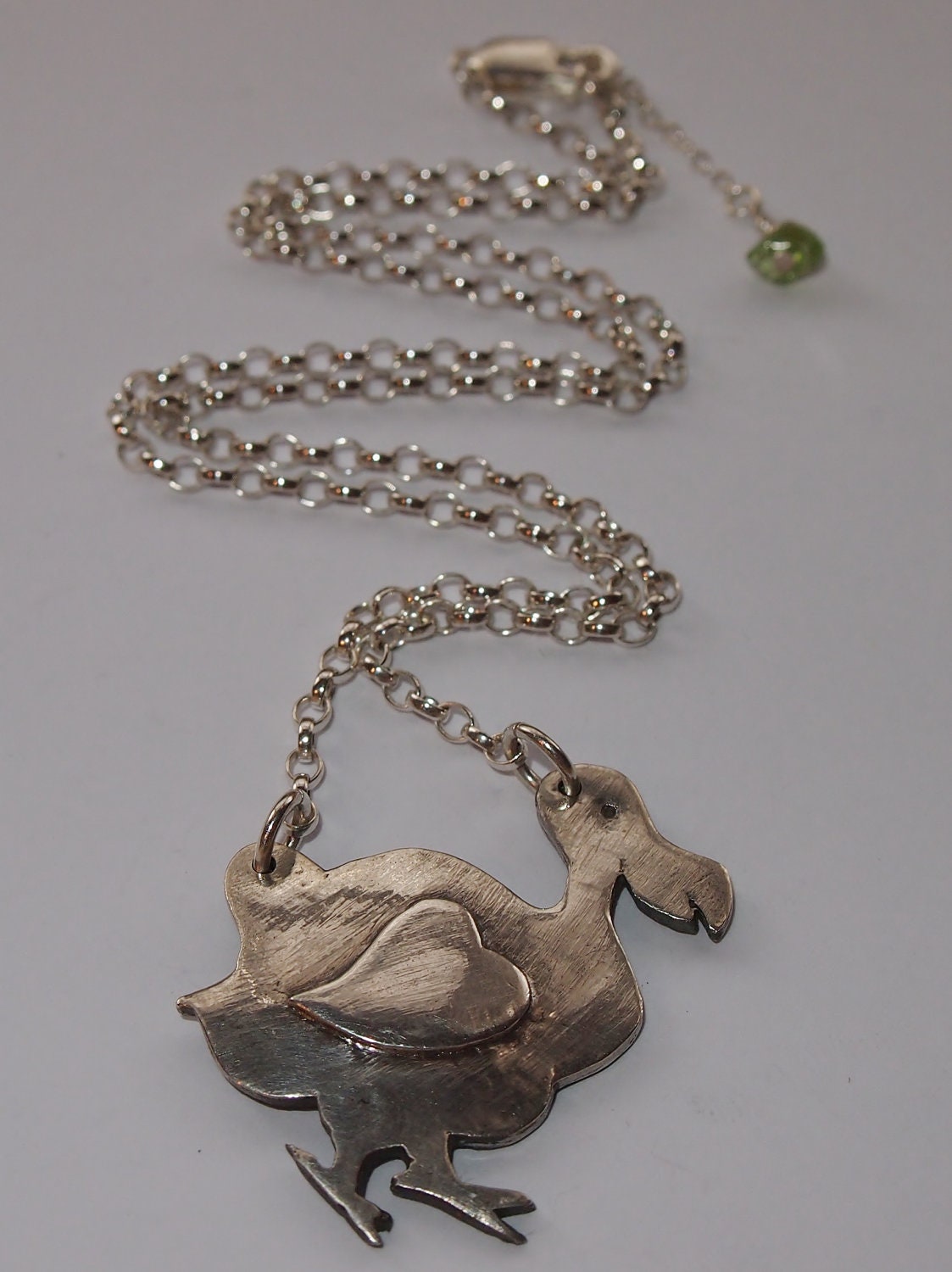 Prove Love isn't  dead with this adorable Dodo, handmade in solid silver.......