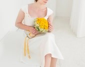 Merle- short wedding dress with a suqare neckline, the waist is decorated by a yellow ribbon with daisies, made of pure silk by noni mode