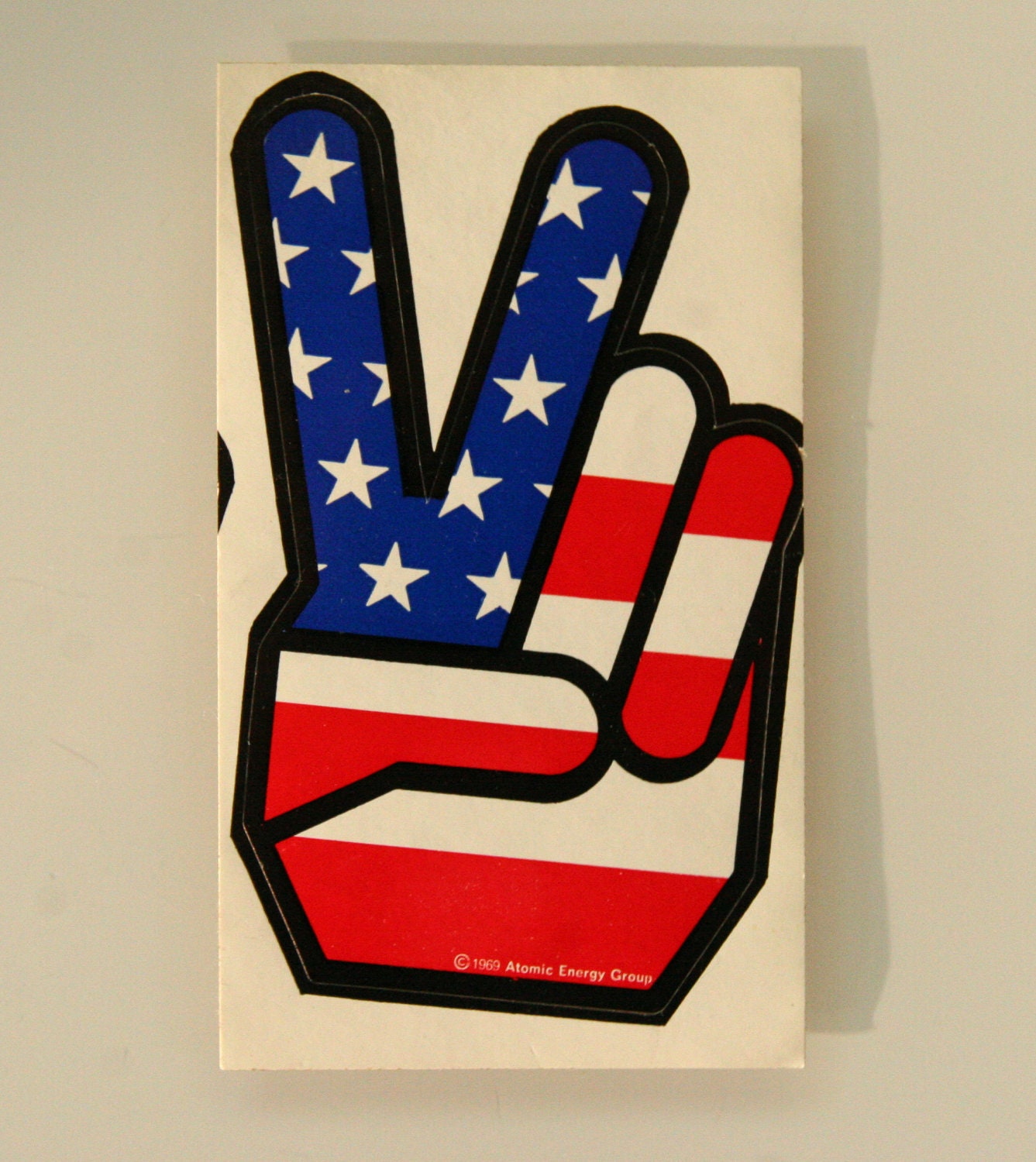 Atomic Energy Group Original 1969 Peace Sign Sticker - Red, White and Blue Hand Shaped Flag - Iconic American Symbol