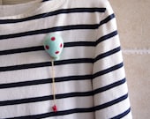 Felted brooch. Needle felted balloon brooch in baby blue and red dots,  Red coral bead hangs at the bottom from gold chain. NB1