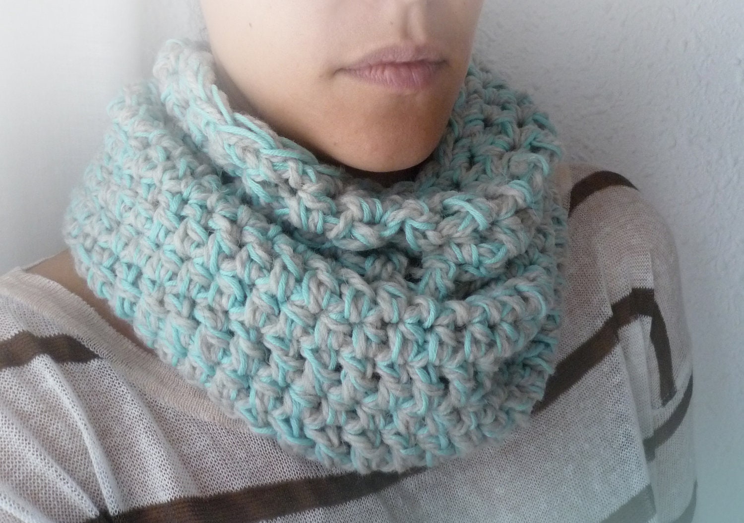 Pale gray and ice-blue cowl in natural wool and organic cotton yarn. Crocheted baby blue and grey snood.
