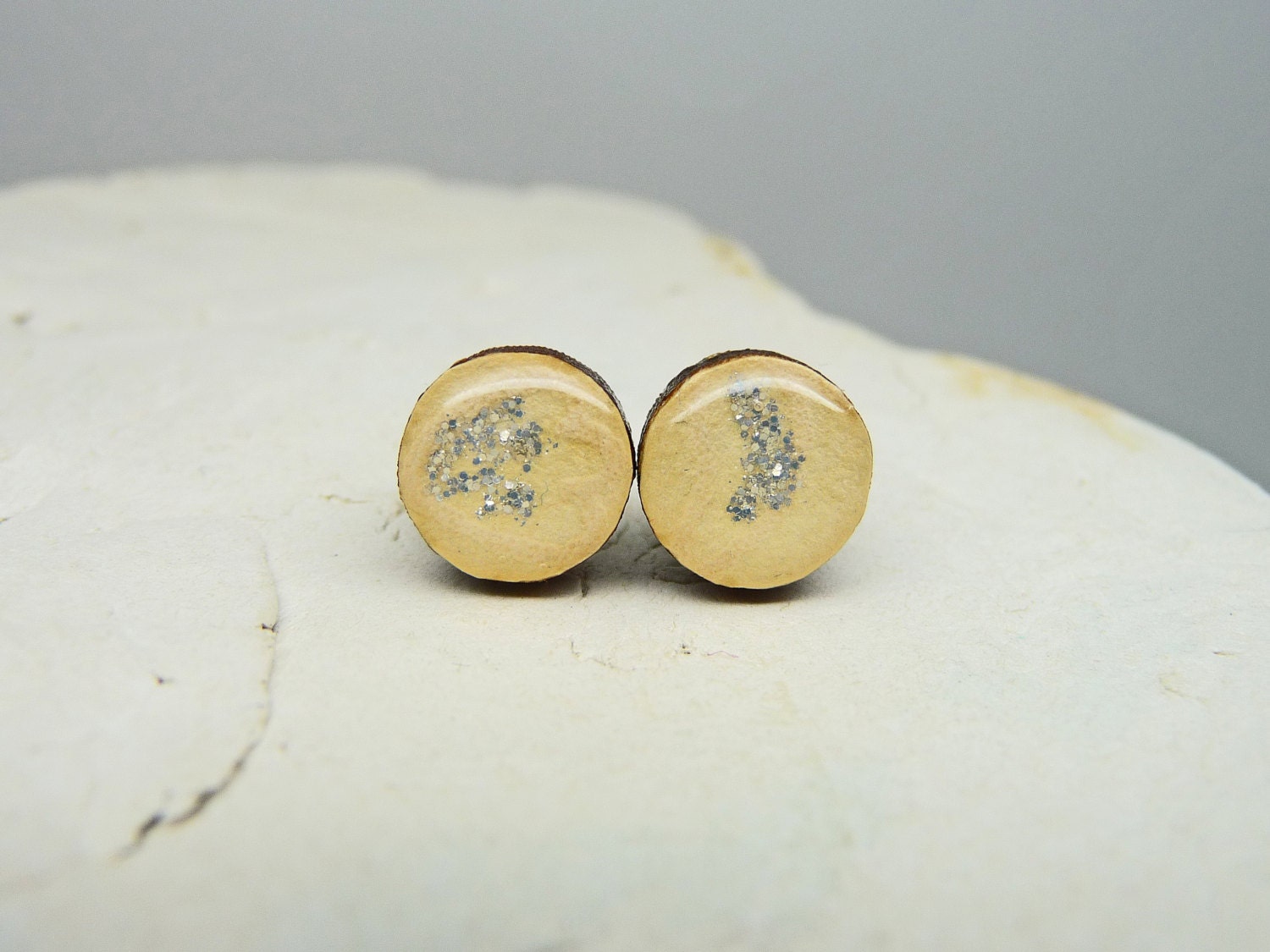 Post earrings ivory cream icing and silver glitter asymmetrical design
