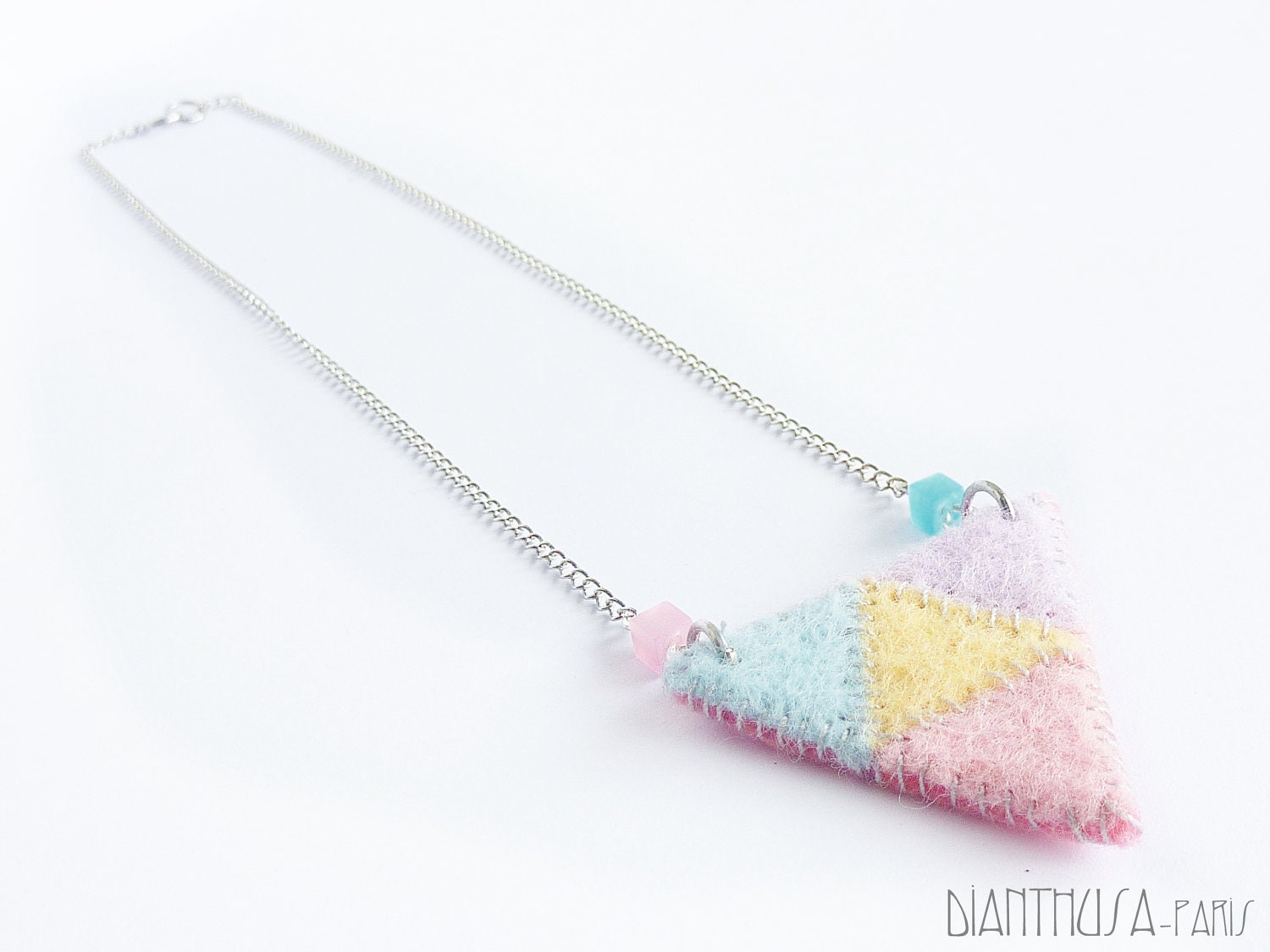 Navajo style necklace. Triangular bib necklace in pink, lilac, blue and yellow pastel tones.
