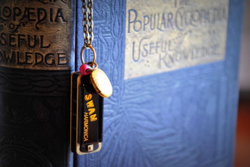 Tiny little harmonica necklace with red bead and locket - handmade and playable