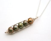 Peapod necklace. Five peas in a pod, metallic forest green pearl pendant on sterling silver chain.