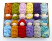12 wood peg people dressed in wool outfits