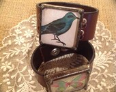 Leather cuff handmade by The Charming Cherub blue bird or butterfly jewelry steampunk