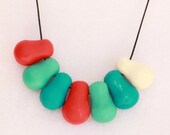 Red, white and blue butternut beads adjustable resin necklace