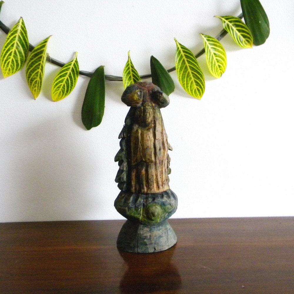 Antique wood statue of a headless saint