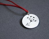 Seed Head, a layered silhouette pendant