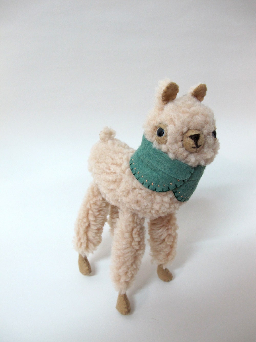 Small Wooly Alpaca in a Leaf Green Embroidered Cape