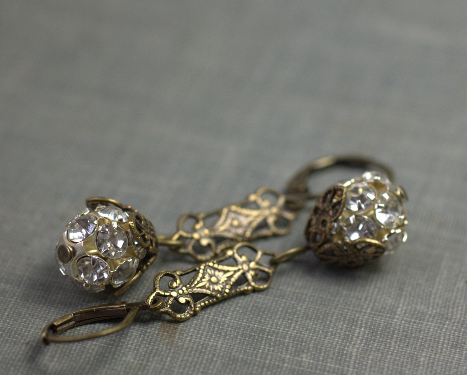 Vintage 1920s style earrings filigree brass rhinestone dangle