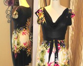 black  baby doll dress with a colorful floral  print