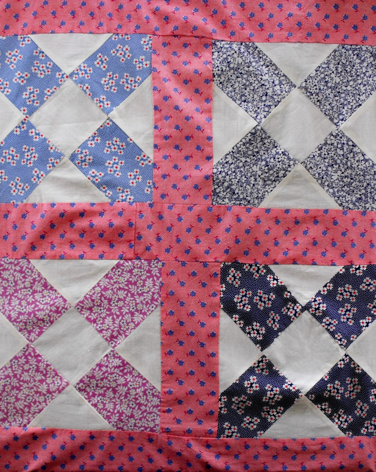 Vintage quilt top, charming 1930s patchwork florals and pink floral sashing