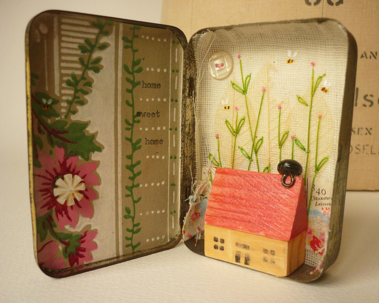 Mixed media collage art in a small vintage, time worn tin ...home sweet home
