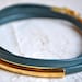 blue grey skinny leather triple wrap bracelet with long gold tube