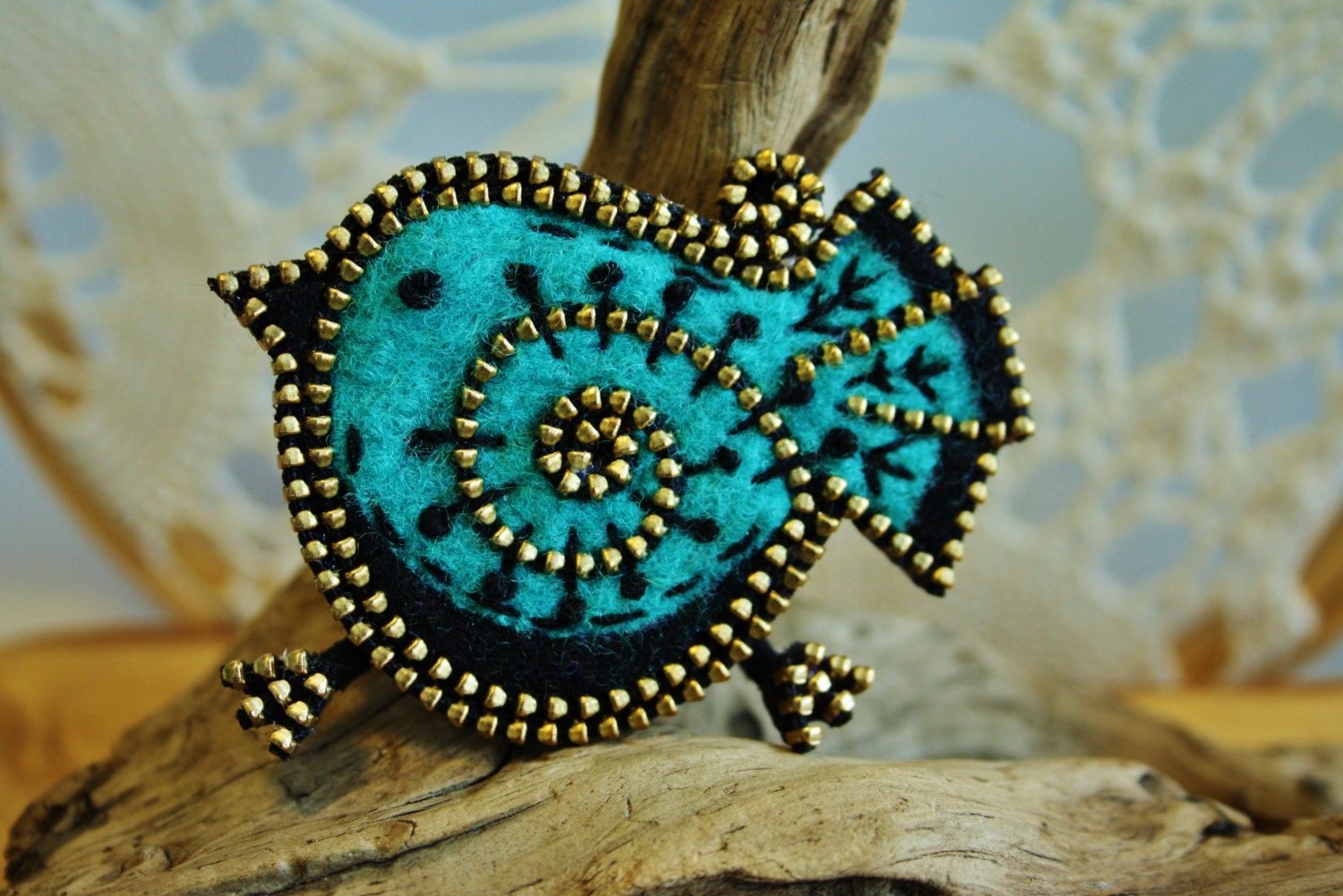 Turquoise/teal and black bird brooch
