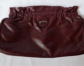 Vintage Etienne Aigner Burgundy Clutch with a Spring Load Closure
