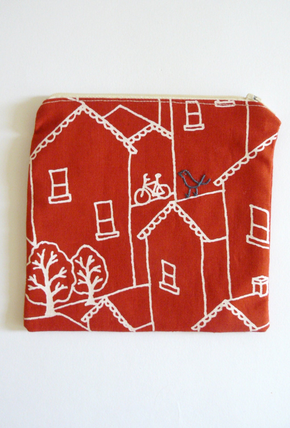 zipper pouch, purse. red bird and mouse embroidery in navy blue with white houses on cherry sustainable cotton designed fabric.