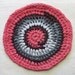 Round trivet, crocheted from eco-friendly cotton t-shirt yarn, large 11" diameter, sun-washed coral red and gray