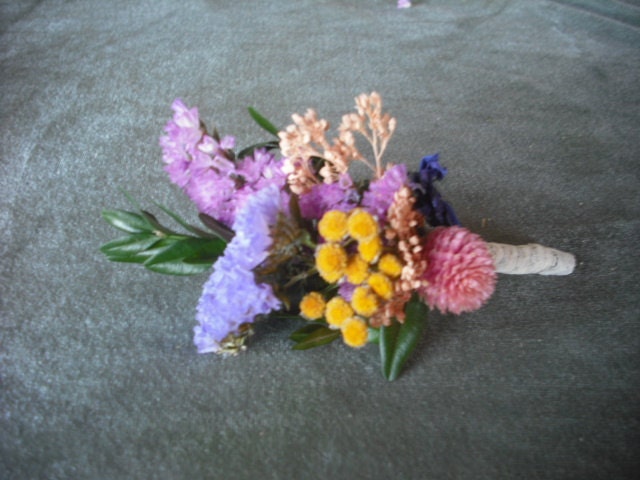 Boutonneire made with colorful dried flowers and herbs. For your groom, bestman and ushers.