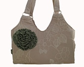Large Shoulder Handbag constructed in taupe floral print with ruffle flower embellishment