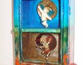 BALANCE a mixed media assemblage altered cabinet art angel and demon heaven and hell