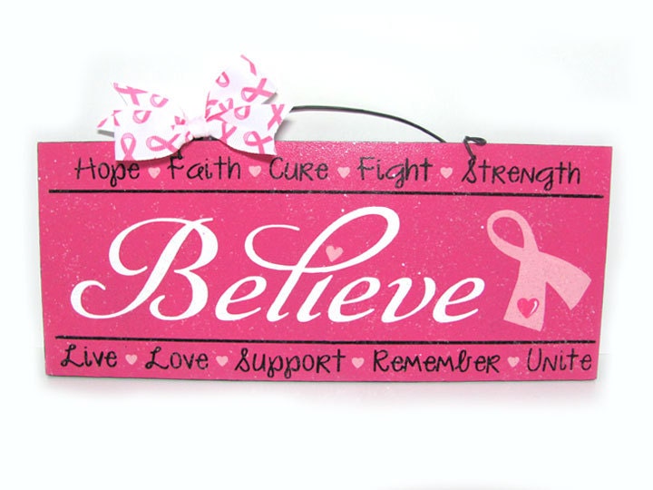 Breast Cancer Awareness sign. Believe with inspirational words. Pink ribbon and clear glitter.