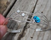 Sterling Silver Cuff Bracelet. Pau Shell. moonstone. Open wavy abstract. Blue. green. white. Woven wired. textured. shiny.OOAK
