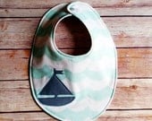 Mint and white ocean waves baby bib with sailboat